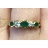 18CT GOLD DIAMOND AND EMERALD FIVE STONE RING STAMPED .750 3.