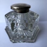 HEAVY GLASS HEXAGONAL PANEL DESK INKWELL WITH SILVER COLLAR AND HINGED LID.