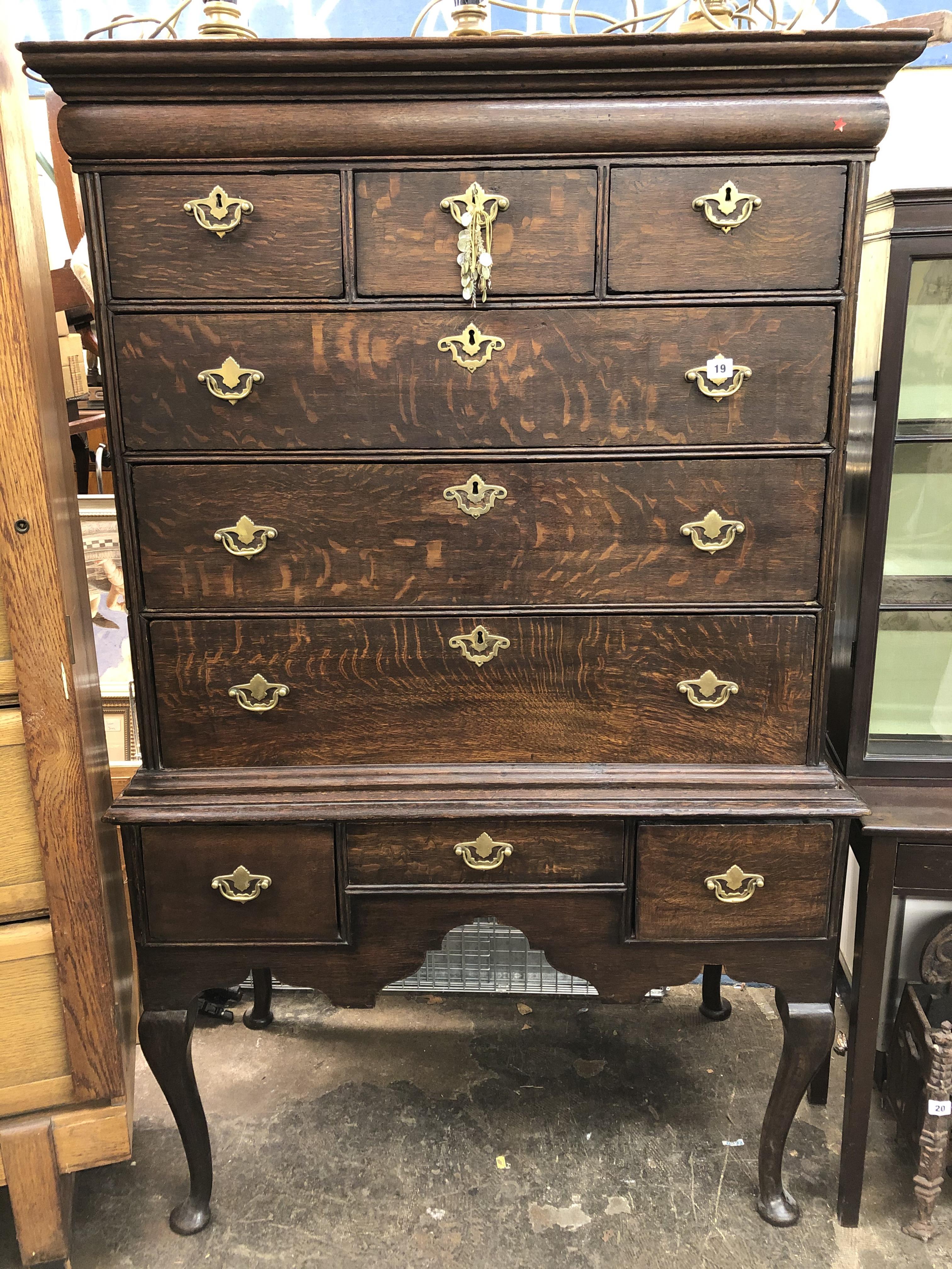 GEORGE II OAK CHEST ON STAND WITH CAVETTO MOULDED CORNICE,CARRIED ON CABRIOLE LEGS WITH PAD FEET.