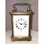 AN ACG BRASS CARRIGE CLOCK,