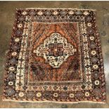 20TH CENTURY CAUCASIAN CARPET WITH A CENTRAL MEDALLION ON A CREAM GROUND WITHIN MAINLY RED AND