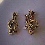 9CT GOLD G CLEF BROOCH AND 9CT GOLD RUBY PETAL BROOCH 3.