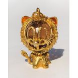 A 9CT GOLD NOVELTY CHARM IN FORM OF A SEATED LION.7.