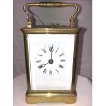 A GILT METAL CORNICHE CASED 8 DAY STRICKING REPEATER CARRIAGE CLOCK17CM HIGH