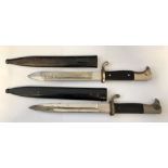TWO WWII GERMAN DRESS BAYONETS IN SCABBARDS -ONE WITH ENGRAVED BLADE
