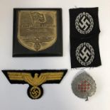 BAG- WWII GERMAN KREIGSMARINE BREAST EAGLE AND KRIEGS PLAQUE-TWO EASTERN VOLUNTEER CAP BADGES AND A