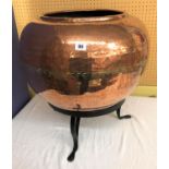 BEATEN COPPER GLOBULAR PLANTER ON RAISED WROUGHT IRON TRIFORM STAND 31CM DIA AT TOP