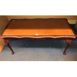 MAHOGANY SERPENTINE LEATHER INSET COFFEE TABLE