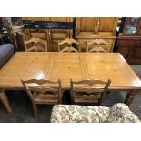 LARGE PINE DINING TABLE WITH FITTED DRAWER ON TURNED LEGS WITH FIVE RAFFIA SEATED WAVY LADDERBACK