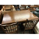 JAYCEE OAK DRAWERLEAF REFECTORY TABLE AND SIX SPINDLE BACK CHAIRS AND AN ELBOW CHAIR