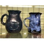 TWO EWENNY POTTERY BLUE GLAZED JUGS A/F