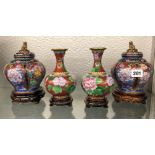 PAIR OF RIBBED BALUSTER CLOISONNE VASES WITH COVERS ON HARDWOOD STANDS AND A PAIR OF BALUSTER VASES