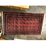 RED CAUCASIAN CARPET WITH DIAMOND PATTERNED MOTIFS ON A RED GROUND 215 X 124CM APPROX
