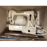 CASED SEWING MACHINE