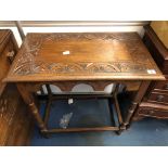 OAK CARVED TOPPED OCCASIONAL TABLE AND A SMALL SERPENTINE FOUR DRAWER CHEST