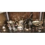 SHELF OF EPNS AND PLATED TEAPOTS, MILK JUGS, DWARF CANDLESTICKS,