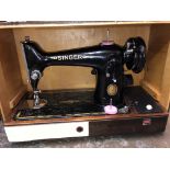 CASED SEWING MACHINE