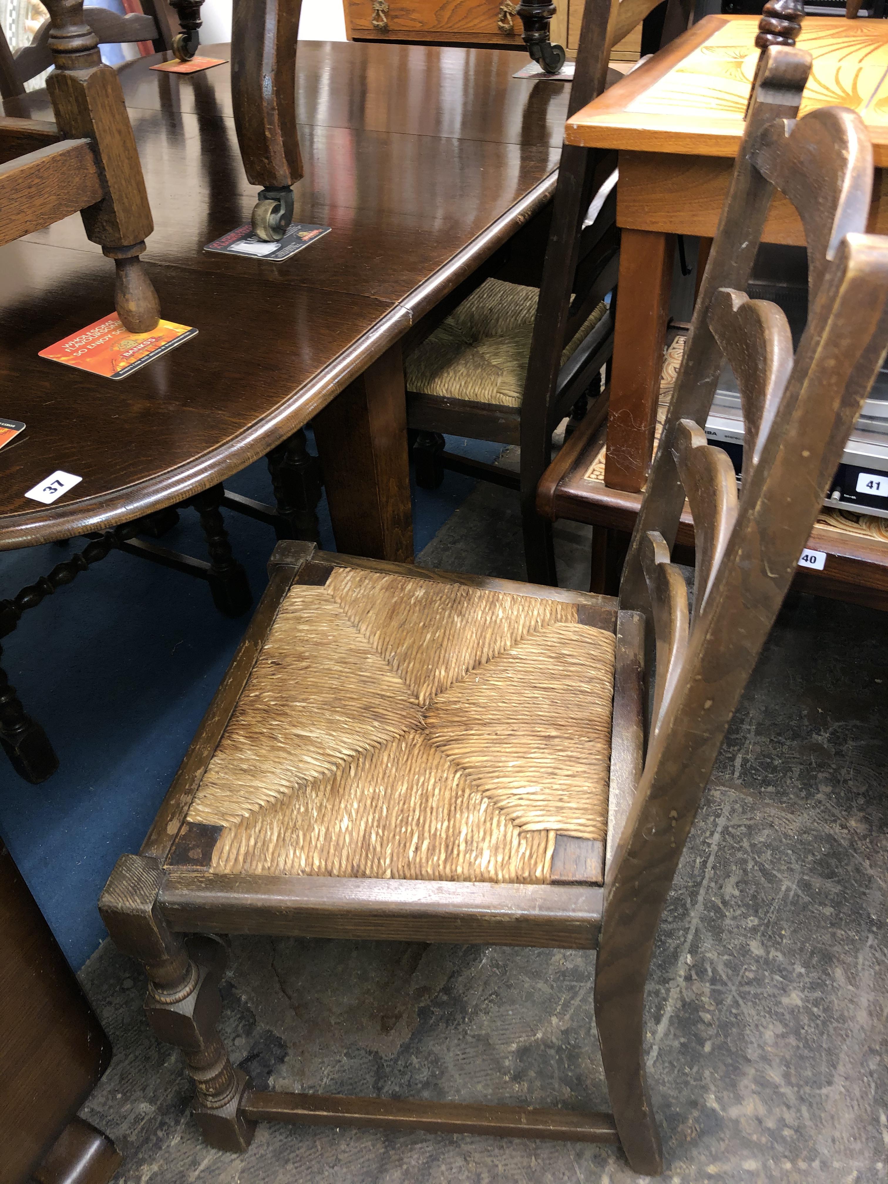 OAK OVAL DROP FLAP TABLE AND FOUR LADDER BACK CHAIRS - Image 3 of 4