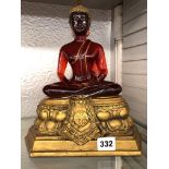 RED AND GILDED RESIN SEATED BUDDHA
