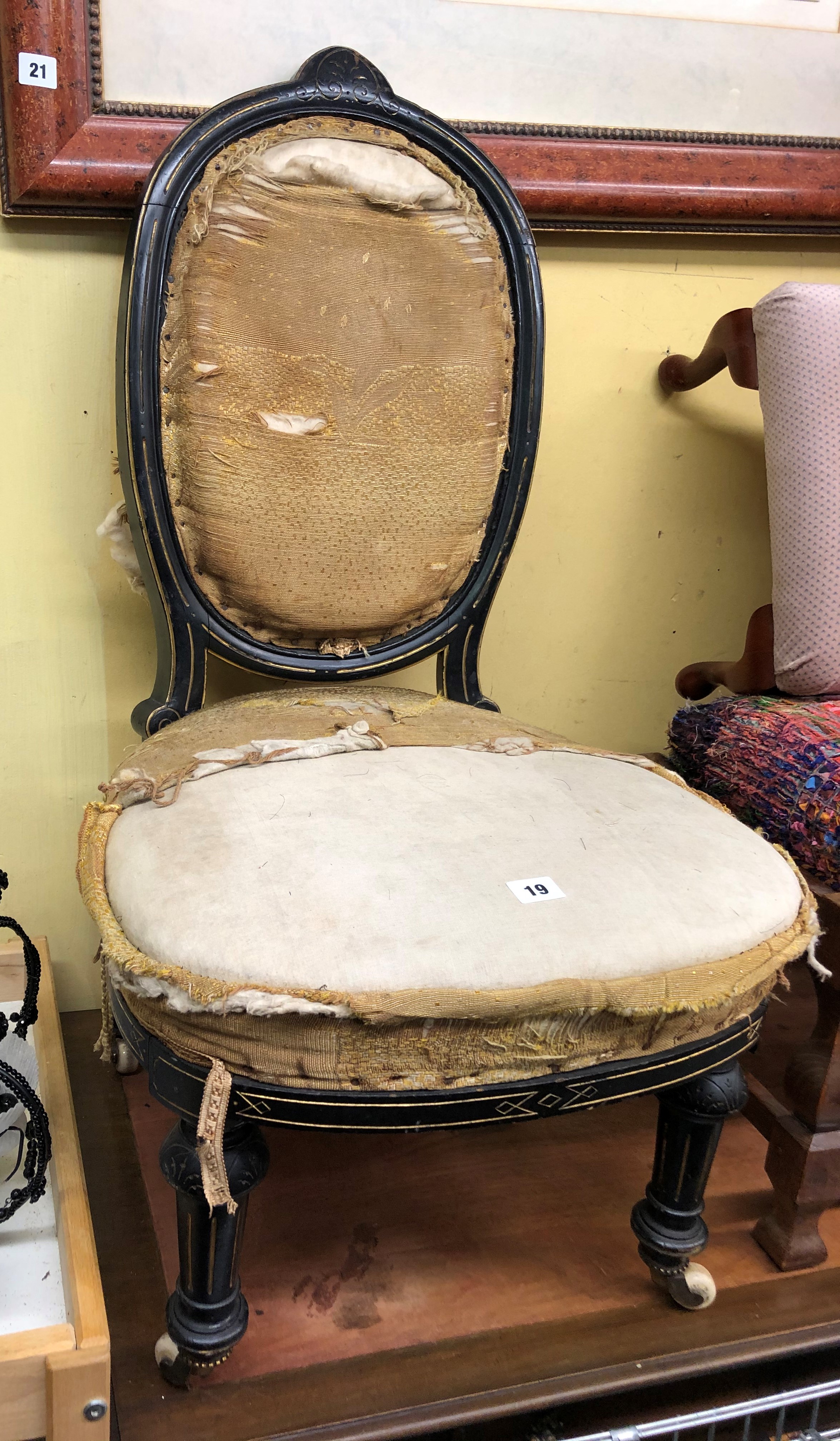 LATE 19TH CENTURY EBONISED AND PARCEL GILDED CAMEO BACKED NURSING CHAIR A/F