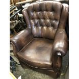 BROWN BUTTON BACK LEATHER SWIVEL ARMCHAIR