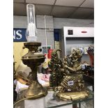 PAIR OF BRASS PUNCH AND JUDY DOORSTOPS AND AN ELECTRIFIED OIL LAMP