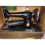 CASED SEWING MACHINE