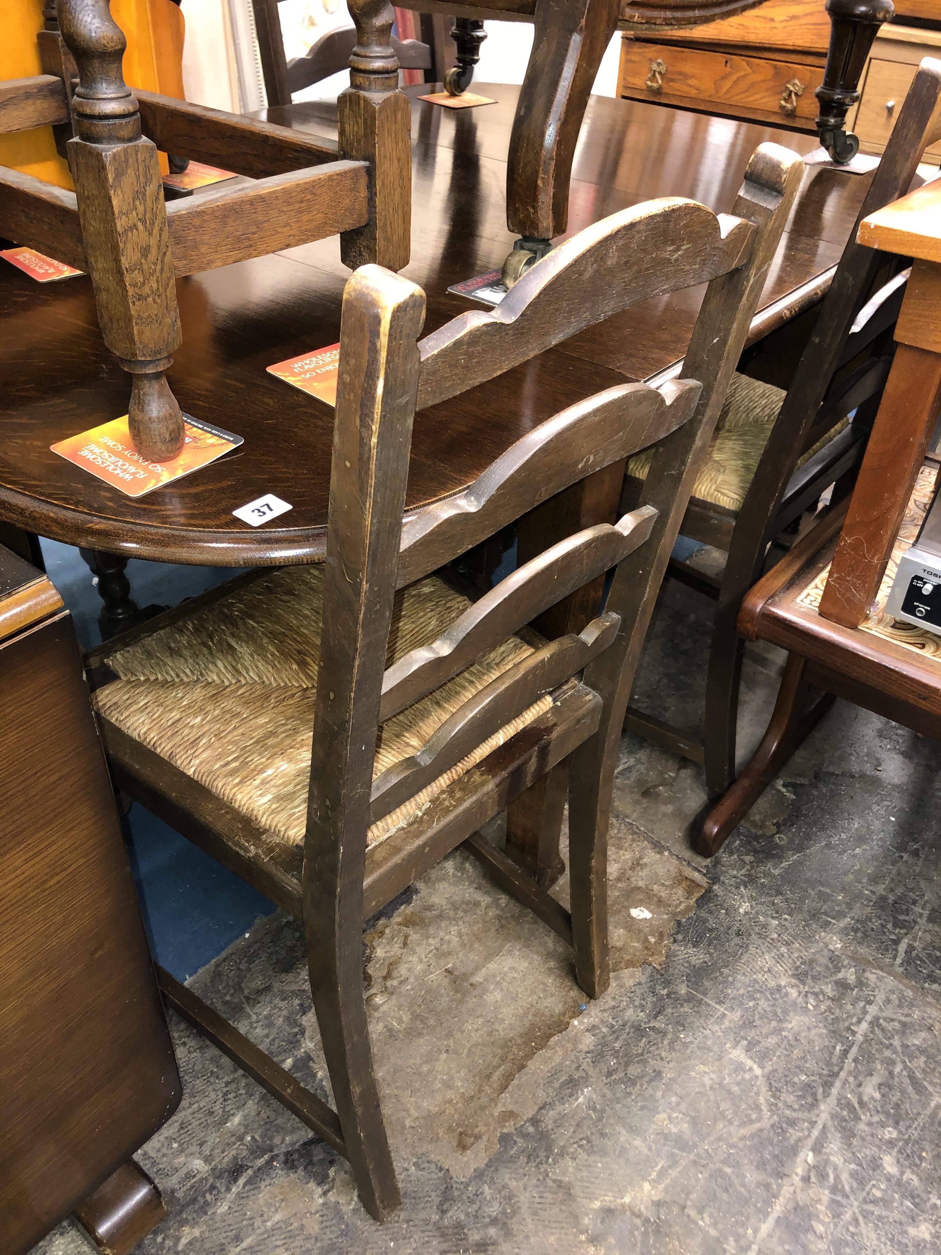 OAK OVAL DROP FLAP TABLE AND FOUR LADDER BACK CHAIRS - Image 2 of 4