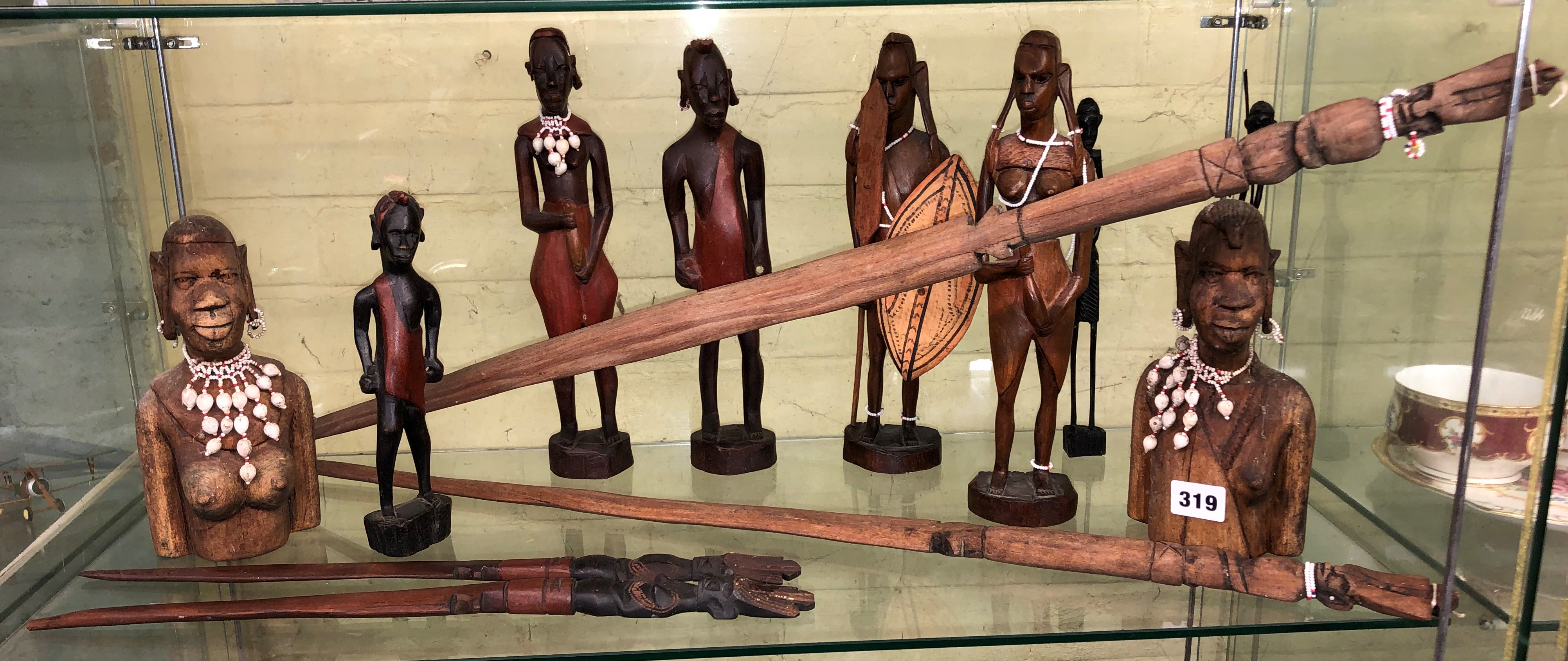 SHELF OF AFRICAN CARVED MASAI FIGURES