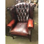 GOOD QUALITY WINE COLOURED LEATHER WING ARMCHAIR