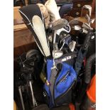 TWO GOLF HOLDALLS OF VARIOUS SETS OF GOLF CLUBS AND A PRO LIGHT CADDY