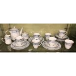 SHELF OF NORITAKE BLUE HILL PATTERN TEA SERVICE