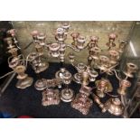 SHELF OF ELECTRO PLATED ON COPPER CANDELABRUMS AND DWARF CANDLE STICKS