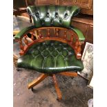 BOTTLE GREEN BUTTON BACK LEATHER SPINDLE RAIL SWIVEL ARMCHAIR