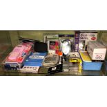 SHELF CONTAINING MP3 HANDS FREE KIT, TENS PAIN RELIEF UNIT, SURGE, PROTECTOR PLUG,