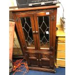 LEAD GLAZED AND CARVED OAK MEDIA CABINET