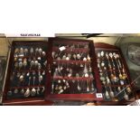 THREE GLAZED CASES OF NOVELTY SOUVENIR TEA SPOONS AND SOME THIMBLES