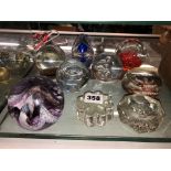 SELECTION OF CLEAR AND COLOURED GLASS PAPER WEIGHTS