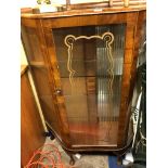 WALNUT SERPENTINE GLAZED CABINET AND A SMALLER GLAZED CABINET