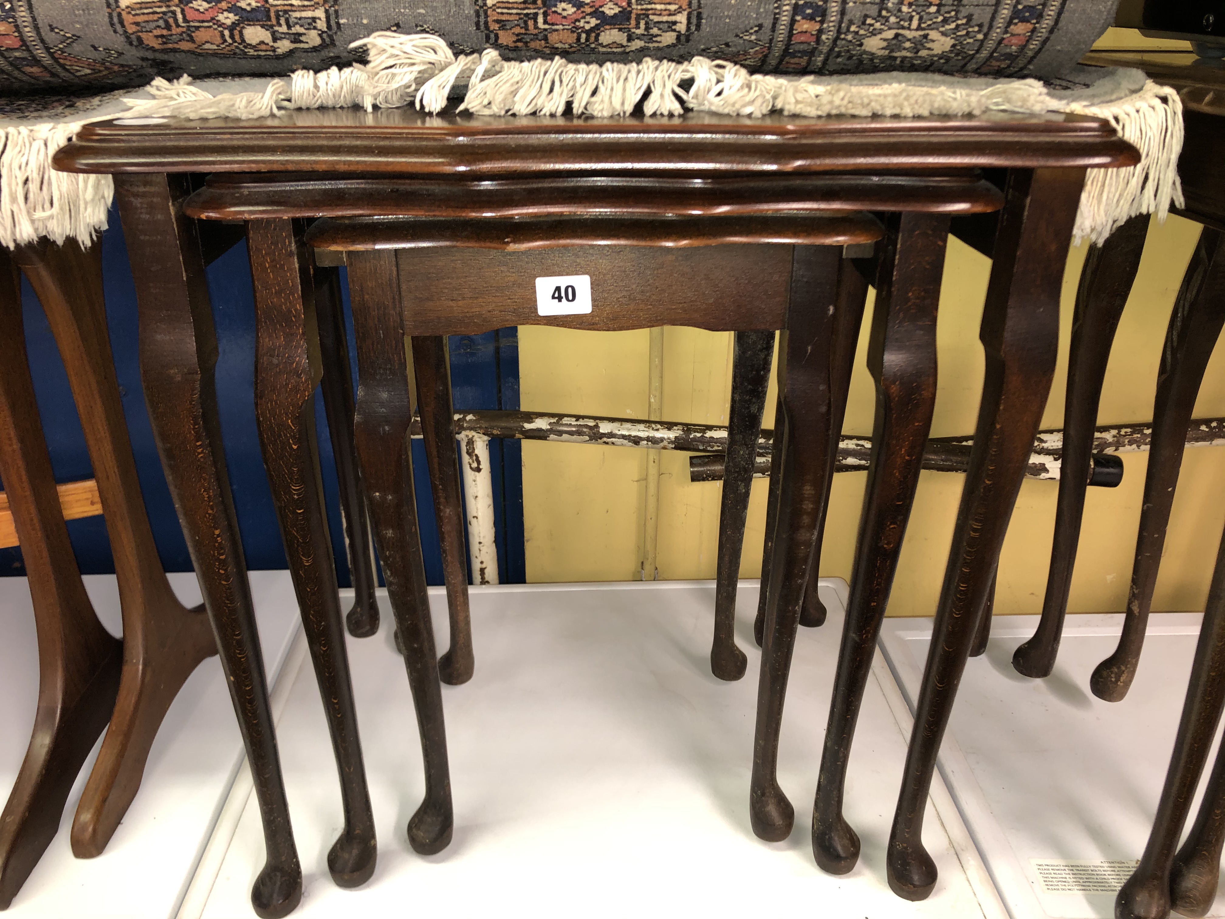 NEST OF THREE SERPENTINE EDGED SPIDER LEG TABLES