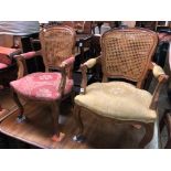 PAIR OF FRENCH STYLE WALNUT BERGERE CANED ELBOW CHAIRS