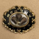 19TH CENTURY BLACK ENAMEL AND GILT MOURNING BROOCH