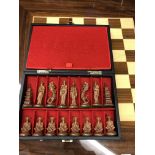 GLOSS CHESS BOARD WITH A CASED SET OF ORIENTAL CHESSMEN
