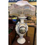 POTTERY BALUSTER TABLE LAMP ENCRUSTED WITH FLOWERS WITH FRINGED FLORAL SHADE