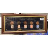 20TH CENTURY MONARCHS COIN AND STAMP COLLECTION FRAMED