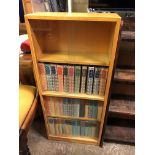 LIGHT BEECH GLAZED SLIDING DOOR BOOKCASE AND BOOKS