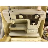 CASED SEWING MACHINE