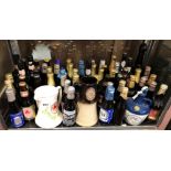 SHELF CONTAINING BOTTLES OF COMMEMORATIVE SPECIAL BREW BEERS AND PALE ALES,