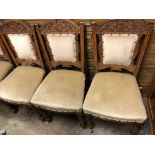 EDWARDIAN CARVED OAK PART PARLOUR SUITE FOUR DINING CHAIRS AND AN UPHOLSTERED NURSING CHAIR