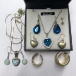 SWAROVSKI CRYSTALS TURQUOISE NECKLACE AND PAIR OF SIMILAR COLOURED EARRINGS AND TWO SILVER BANDS,
